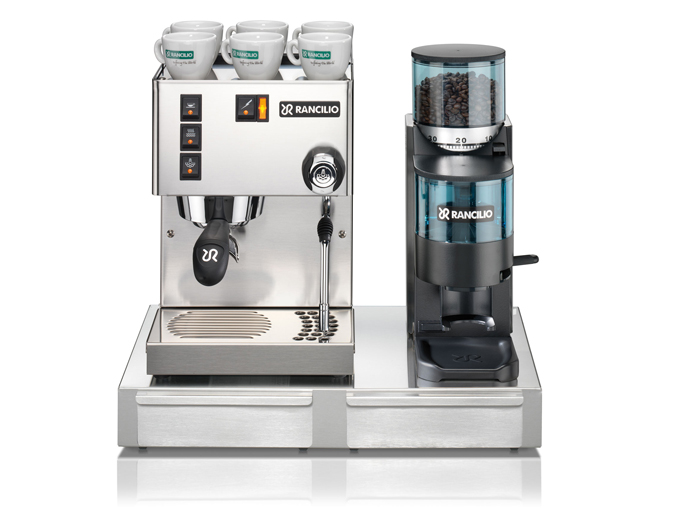 This image is a front view of the Rancilio Sylvia home espresso machine, 1 group at traditional height, semi-automatic dosing controls, next to the Rocky SS grinder.